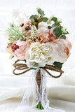 Blush Wedding Handing Flowers